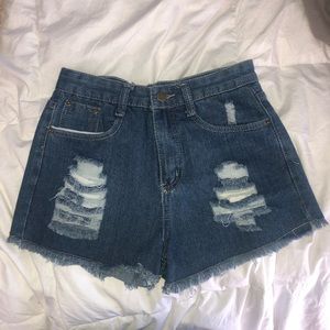 Ripped Denim Jeans with Fringed Trim